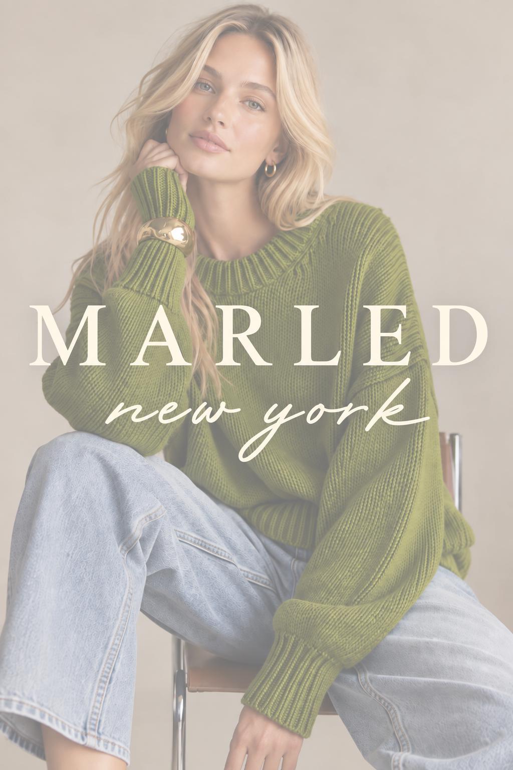 Marled New York campaign image featuring a green chunky-knit sweater
